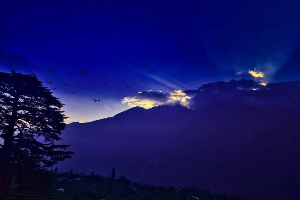Sun rays behind Kinner Kailash range Sun rays behind Kinner Kailash range