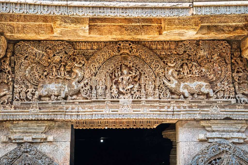 Beautifully carved frescoes above the lintel Beautifully carved frescoes above the lintel, with dancing Shiva at the centre