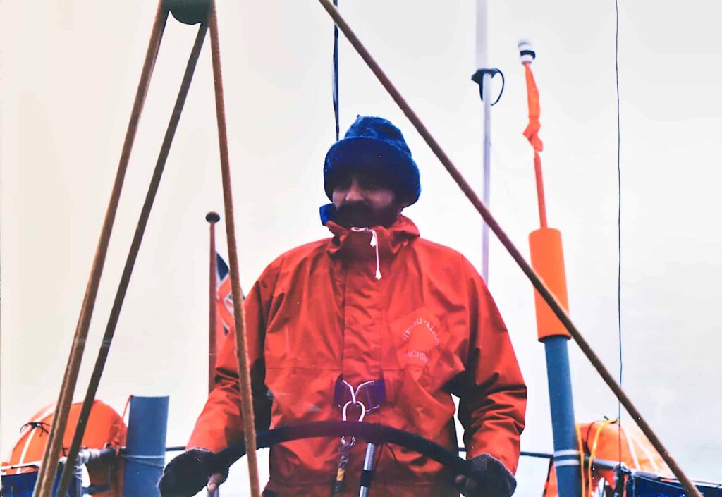 Sailing in dense fog on a cold morning