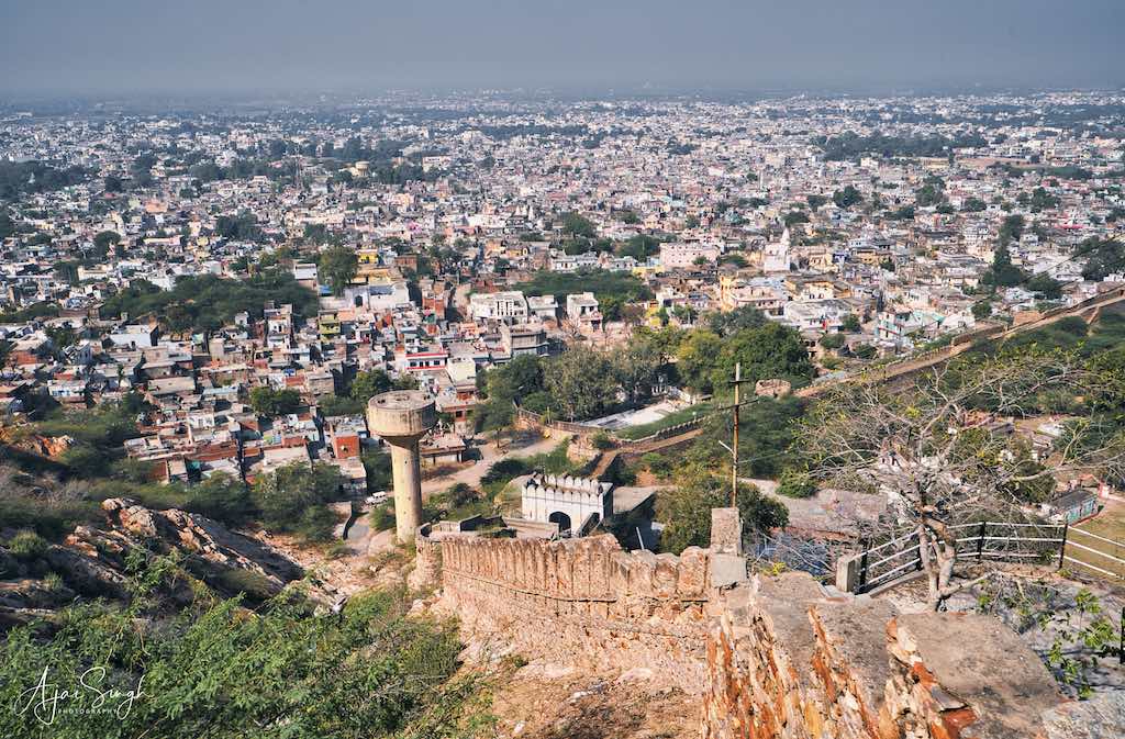 The fort wall runs at the base of Devagiri Hill