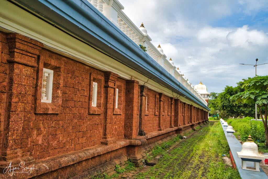 The massive laterite stone boundary wall