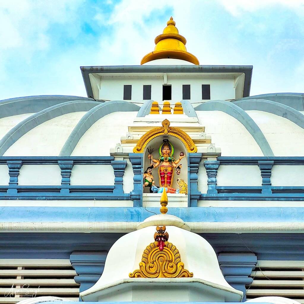 Deities adorn the roof of the temple