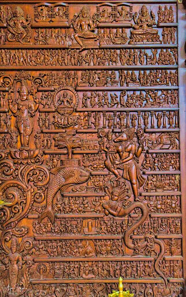 Intricate carvings on the walls of the garbh griha