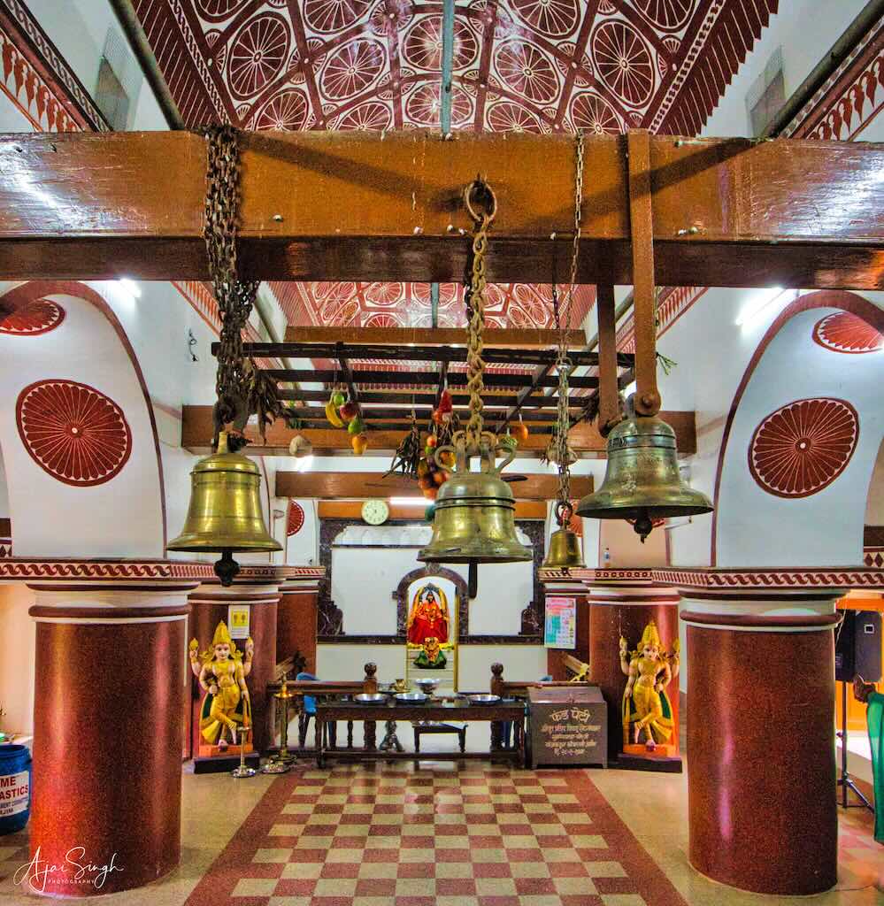 The columns and roof of the garbh griha is covered by Kaavi art