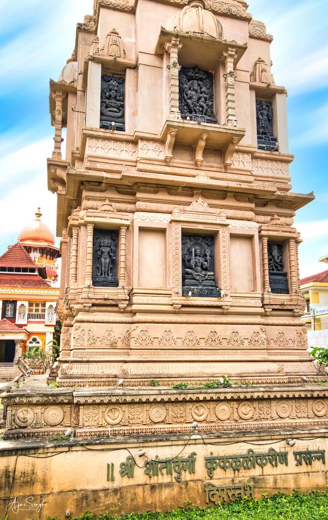 The depictions of various deities on the tower