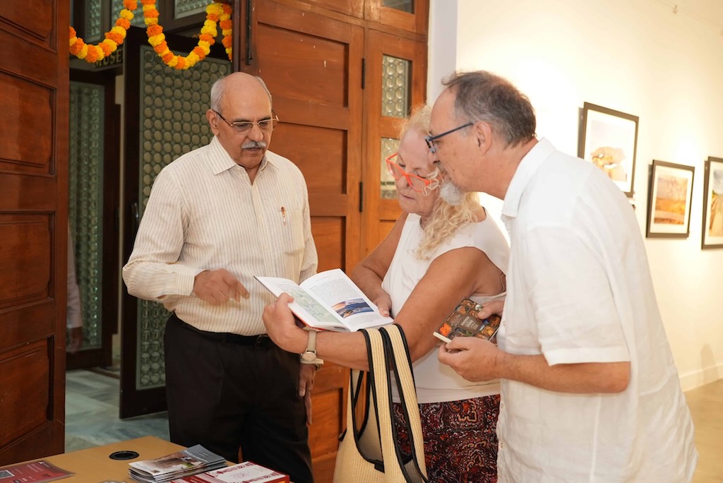 A curious foreigner inquires about the significance of various depictions in temple art